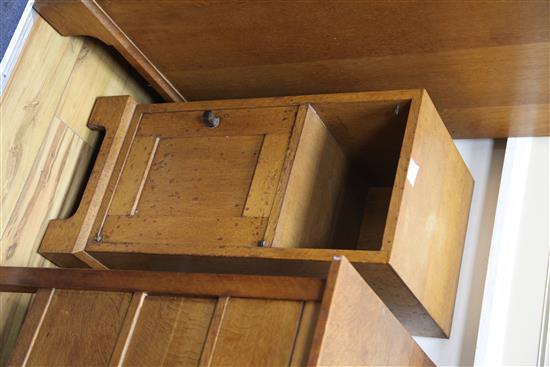 A pair of Gordon Russell oak bedside cupboards W.31cm